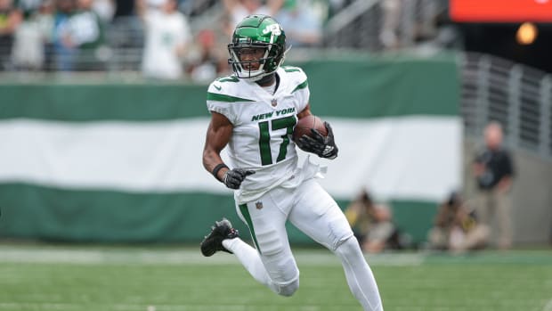 Jets' WR Garrett Wilson runs after making a catch in 2022